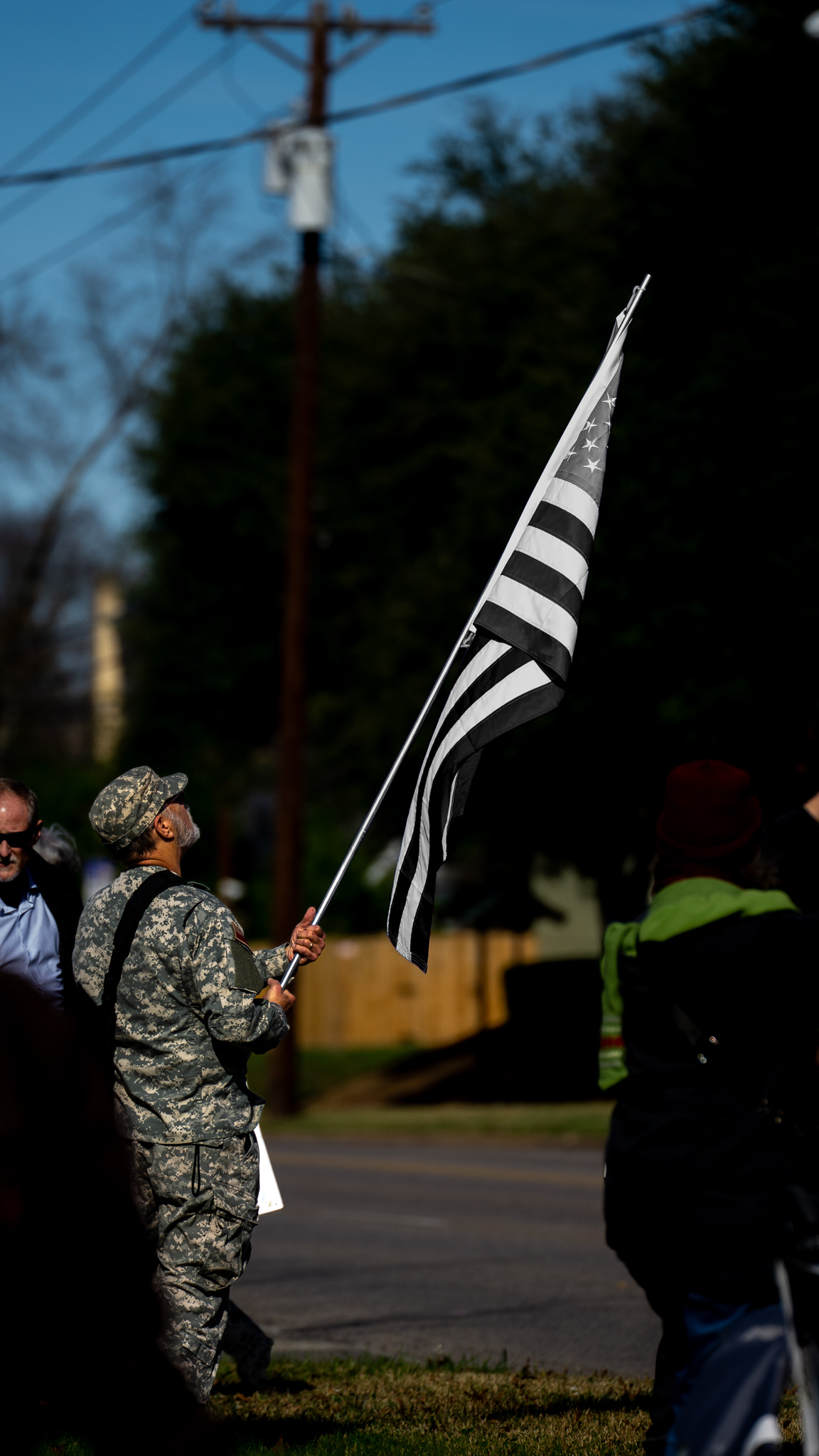 Artistic edit: veteran with black and white American flag