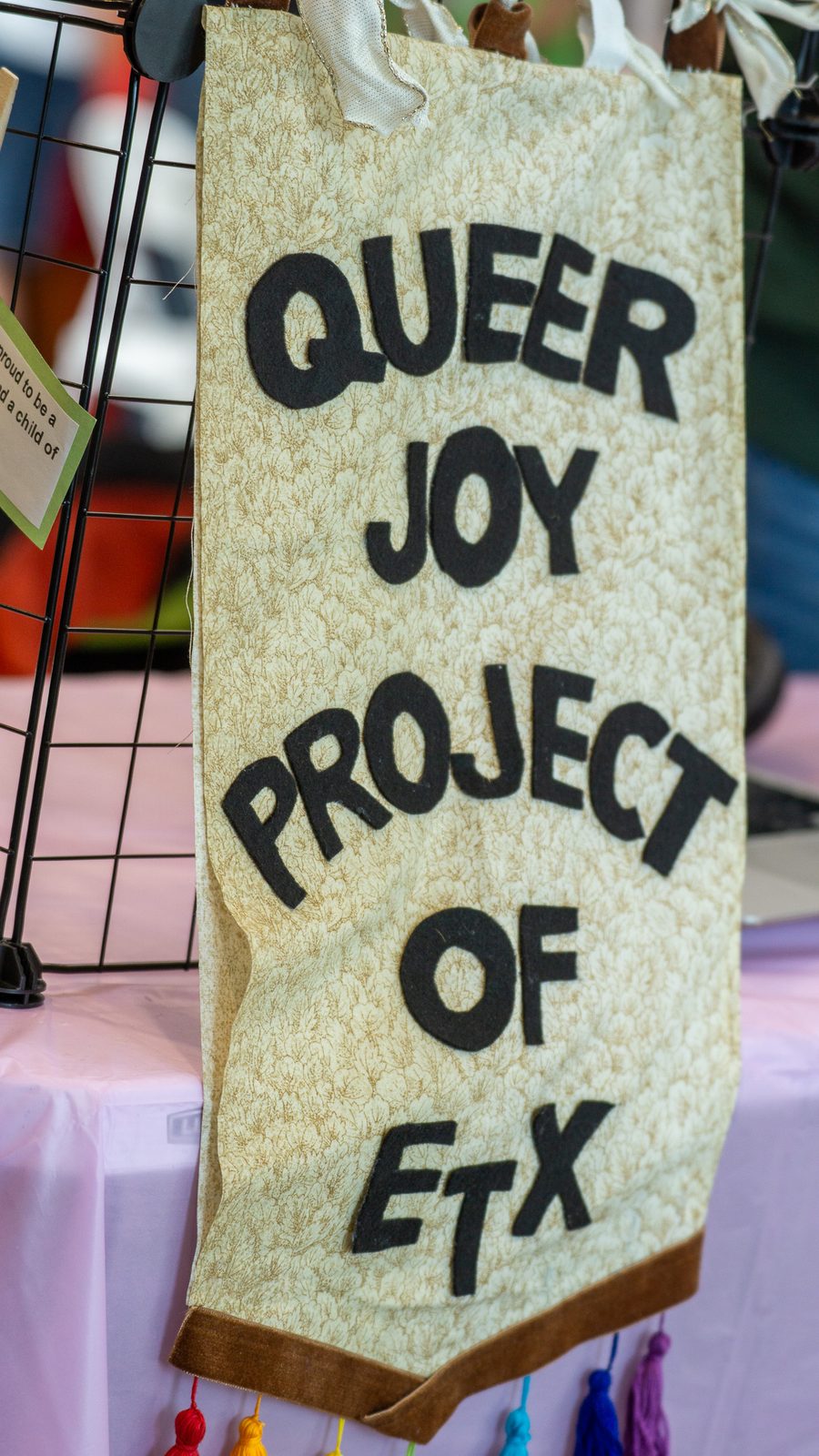 Hand-lettered Queer Joy Project of ETX banner at the festival