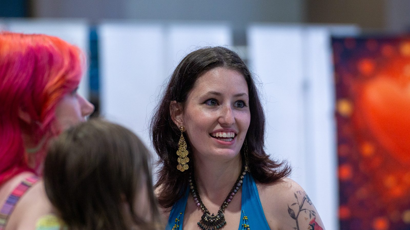 Attendee smiling warmly in the audience
