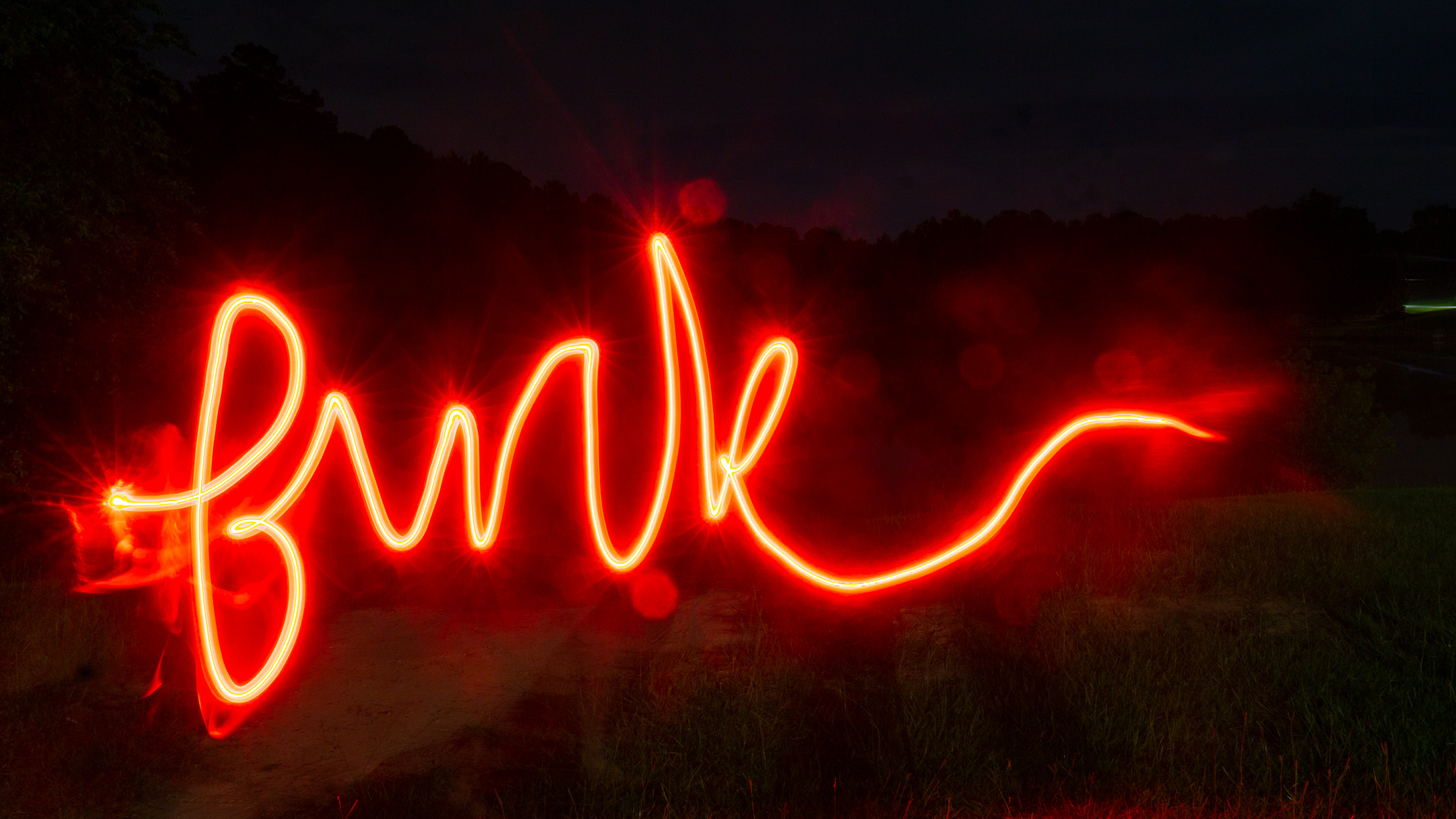 Light painting: blue glowing sprout with leaves