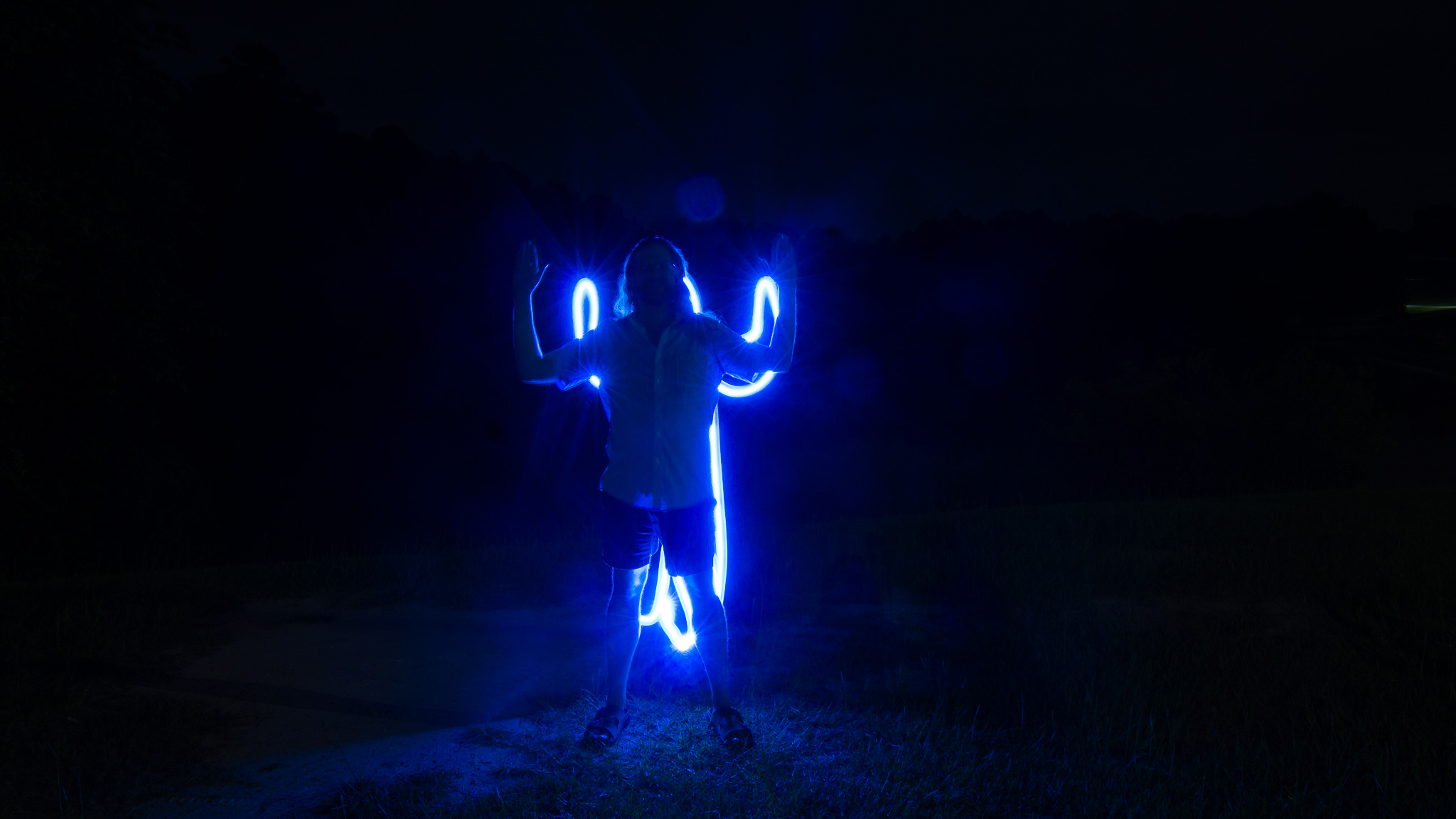 Light painting: glowing blue figure outline