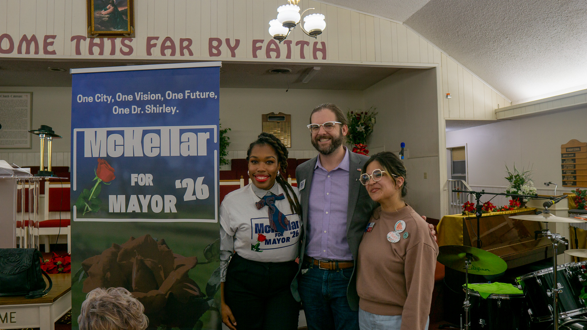 Candidate posing with community supporters at campaign event