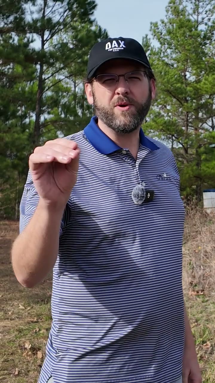 Dax Alexander gesturing to camera during an outdoor campaign reel